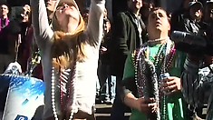 Babes having fun in Mardi Gras flash their tits at the crowd